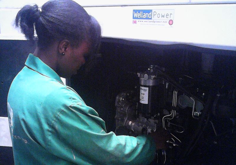 Technician servicing a generator